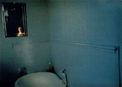 Self-portrait in blue bathroom, London